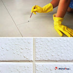 Application de joint de carrelage au pinceau sur sol beige et carreaux blancs perlés d'eau